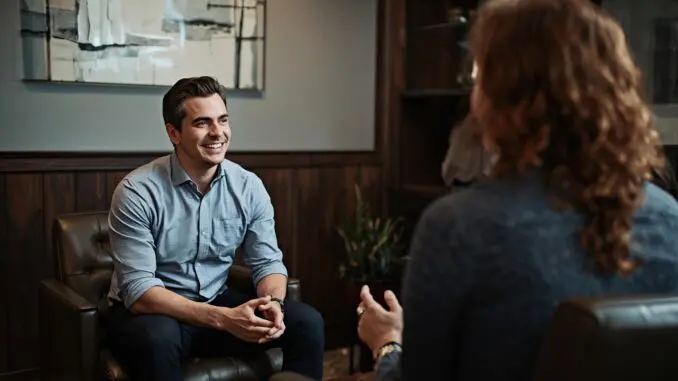 Compassionate trauma therapist meeting with client in comfortable Chicago therapy office