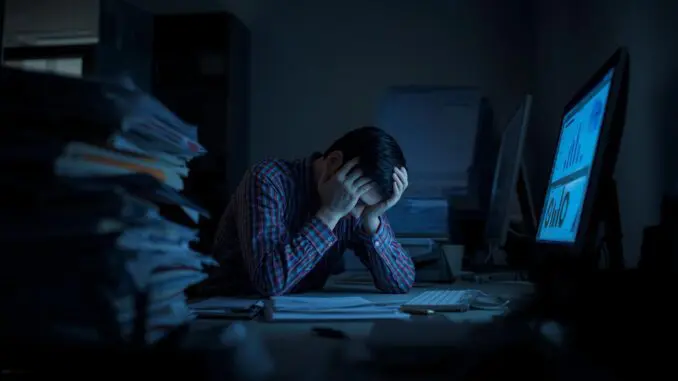 work burnout and stress person in Chicago stressed out at computer