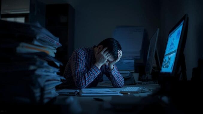 work burnout and stress person in Chicago stressed out at computer