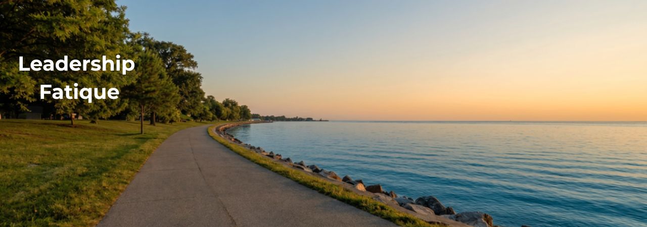Chicago lakefront path at sunrise symbolizing reflection, resilience, and leadership fatigue